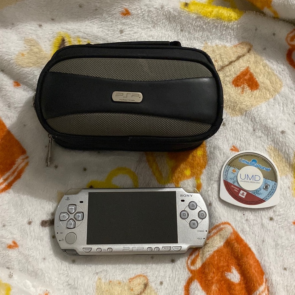 PSP w/ Carrier, Charger and One Game